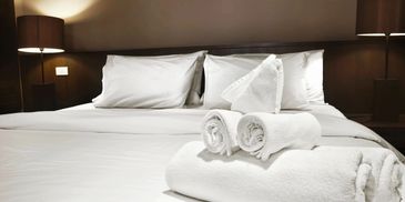 Rolled towels placed on the bed