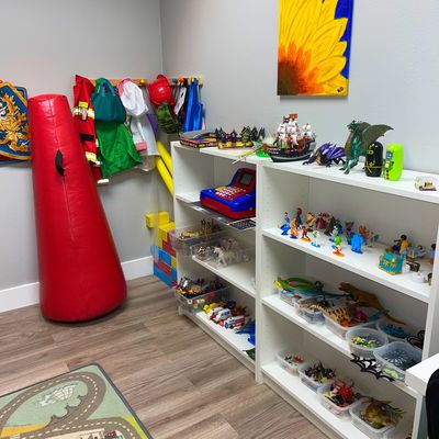 The play therapy room offers sand tray, toys, bibliotherapy, and more to support growth and healing.