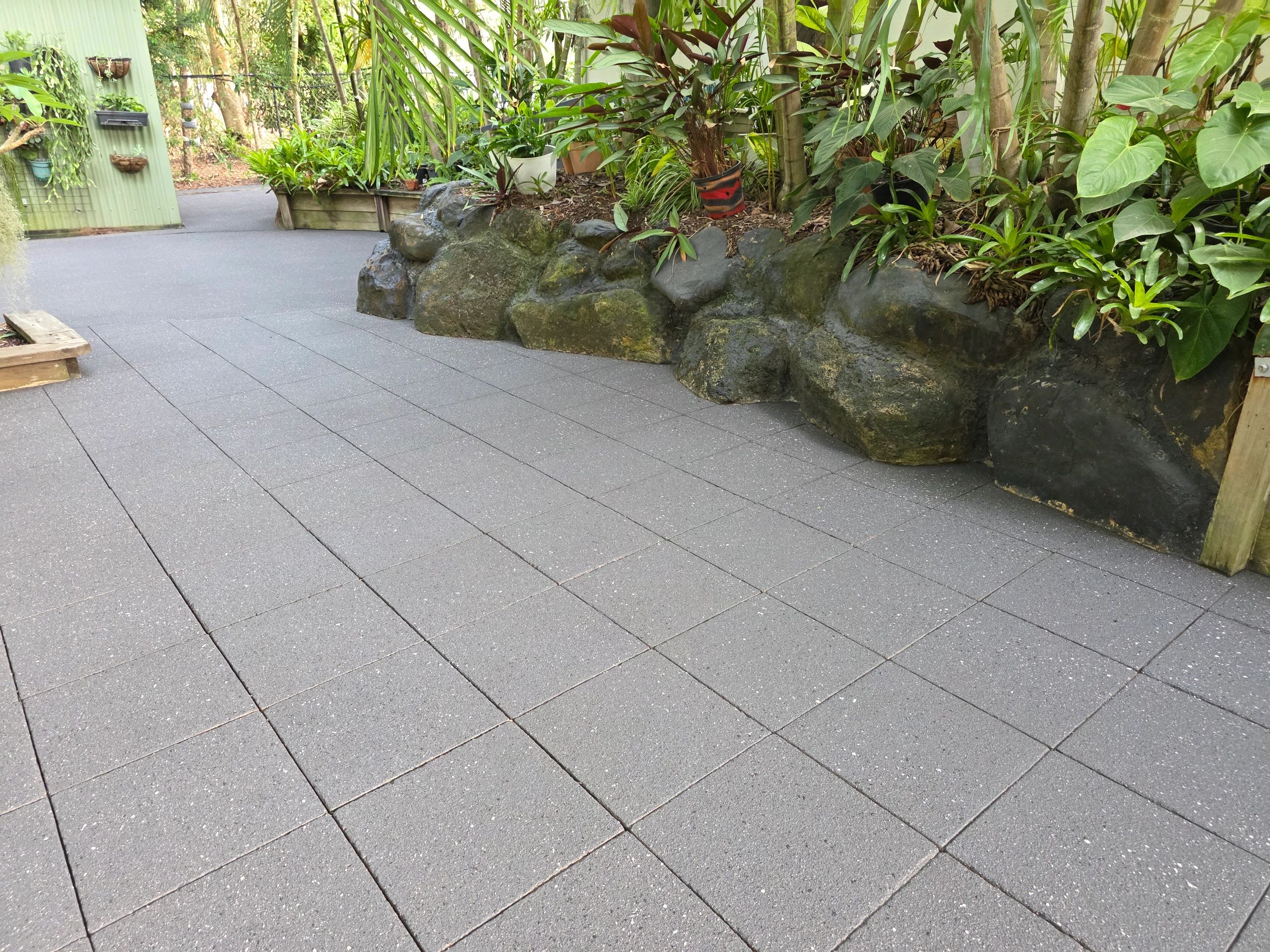 Spray Pave in Gunmetal with Silver Sands & Jet Black Flecks applied over existing pavers.