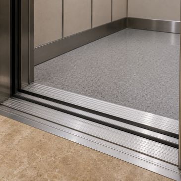 Close-up of an open elevator door showing the floor transition.