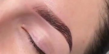 Close-up of a groomed eyebrow.