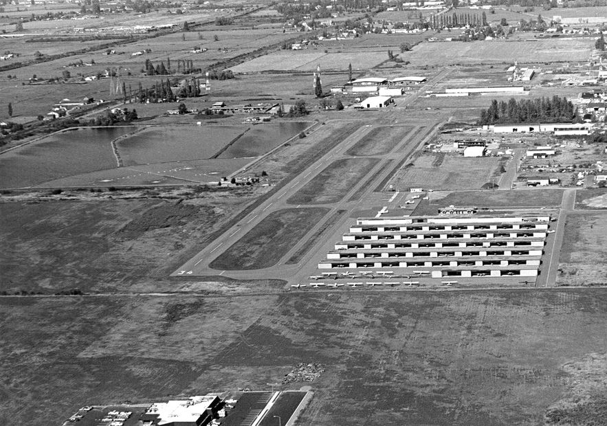 Old black and white aerial photo of the airport.
