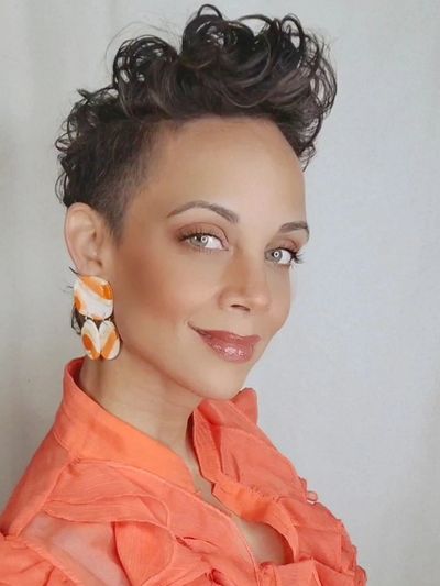 A woman wearing an orange colored dress