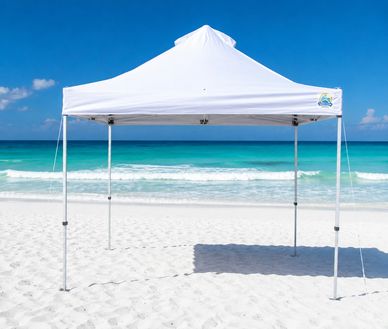 White canopy set up on a sunny beach.