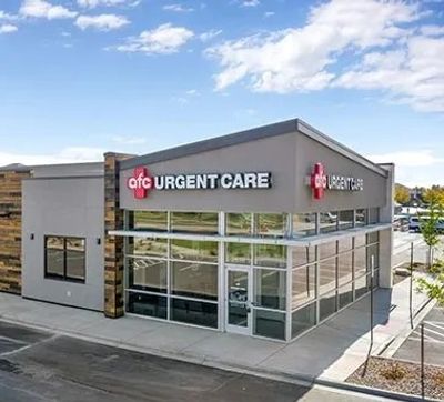 Modern AFC Urgent Care building with glass windows.