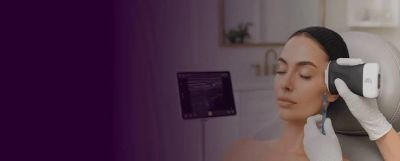 Woman receiving a facial skin treatment with a modern device.