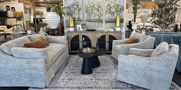 soft grey couch set displayed in the center of our showroom