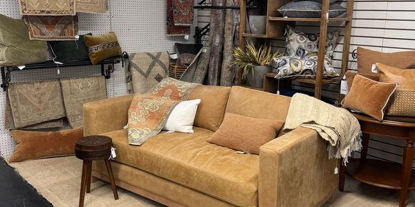 a lovely leather couch in our showroom near our turkish rugs