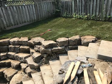 retaining wall, rock wall, interlocking, steps, backyard, landscaping, hard scaping