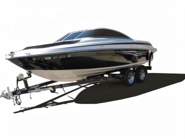 Sleek black and white motorboat on a trailer.