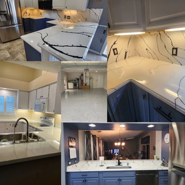 Collage of modern kitchen featuring white marble countertops with black veining and blue cabinets.