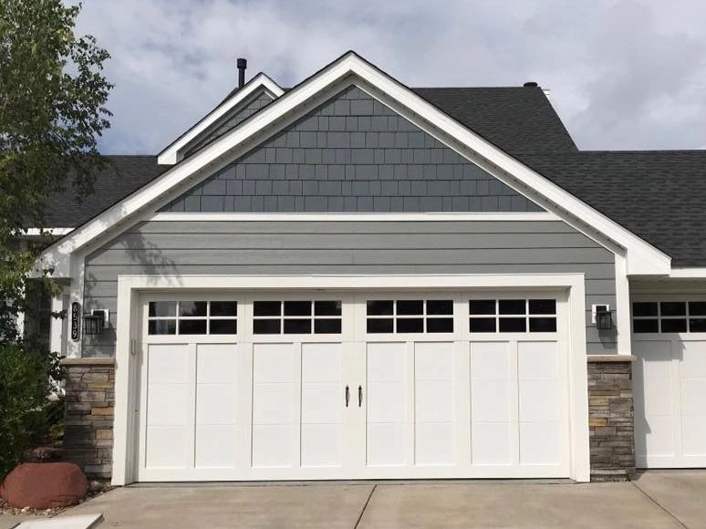 Repaired garage door on a Minneapolis home, restoring functionality and appearance