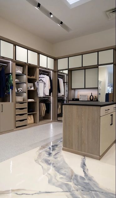 Custom Walk-in Closet, with LED Lights, Mirror Doors and Island with Leather wrapped Countertop.