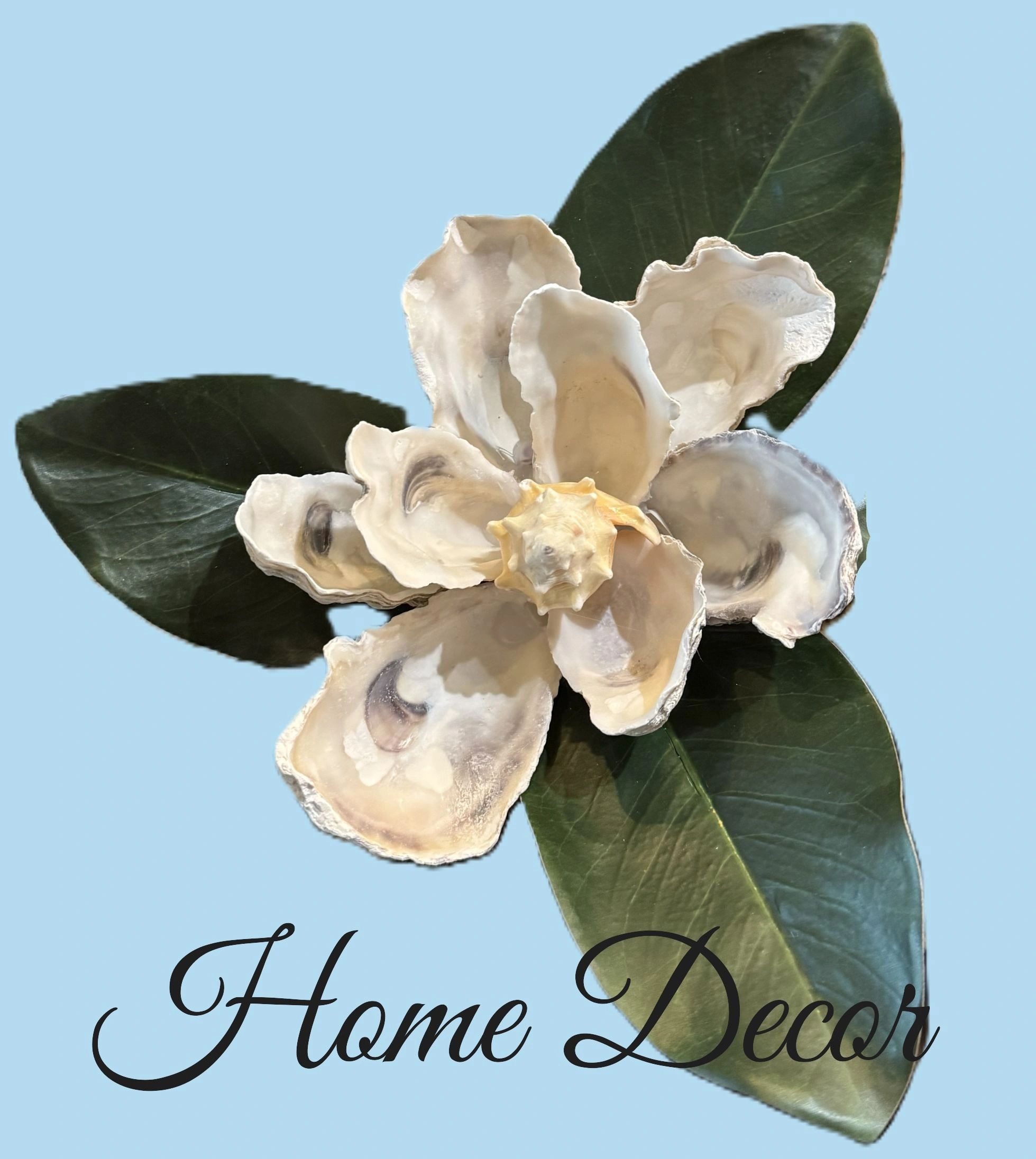 Decorative flower made from oyster shells and green leaves on a blue background.