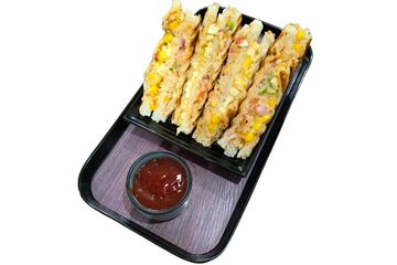 Grilled vegetable sandwiches served with tomato ketchup on a black tray.