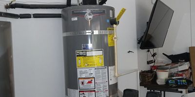 A technician performing in-demand tankless water heater installation in San Lorenzo, CA.