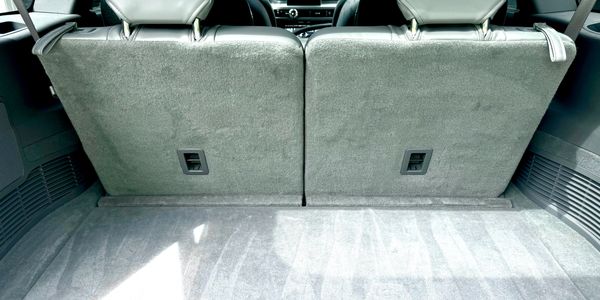 Back seats and trunk interior detail shampoo, steam, extract upholstery. Vacuum and cleaned detail
