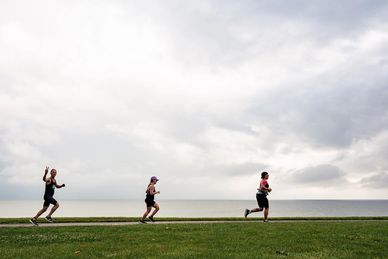 Tri CLE participants at upper Edgewater running on the multipurpose path. 