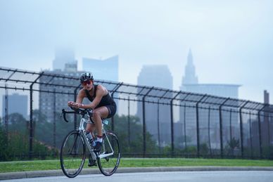 Tri CLE participant riding her bike on the Memorial Shoreway