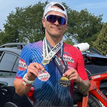 Ambassador Johnny with his Tri CLE medals