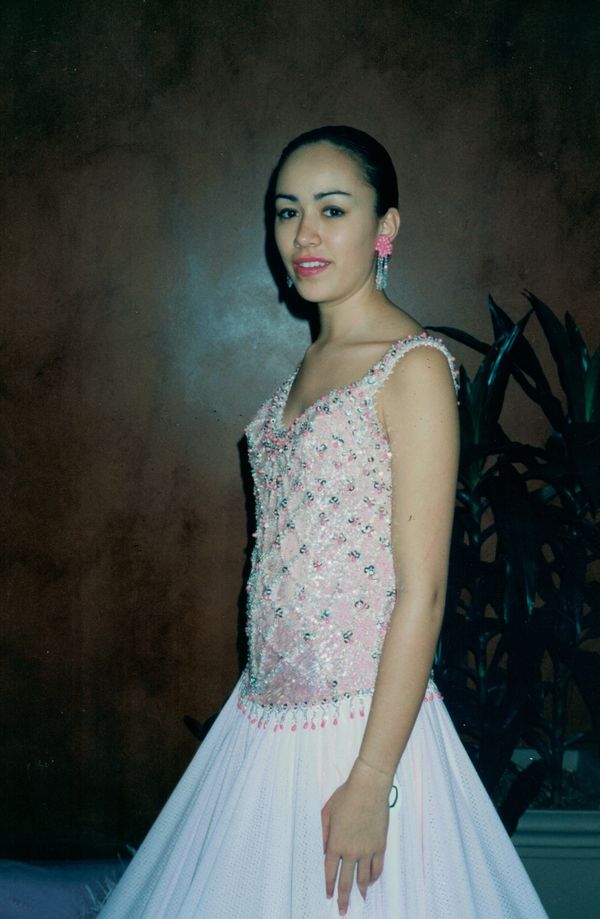 Imagination Heavily beaded bodice with interlocking hand-beading arranged in a mesh-like pattern.