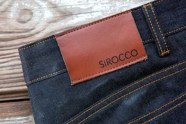 Close-up of Sirocco jeans tag – clean product branding