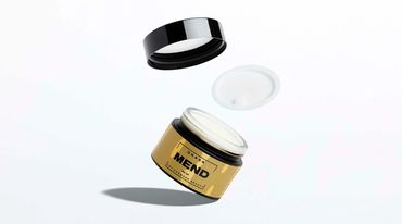 MEND skincare jar on white surface with soft shadow.