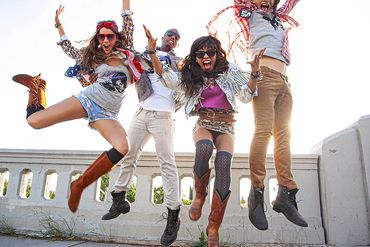Group jumping in air – dynamic fashion campaign energy