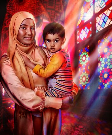 Portrait of a Muslim woman in a mosque holding her child
