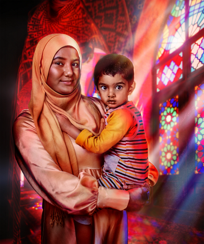A woman in a hijab holding a child with colorful stained glass windows behind.