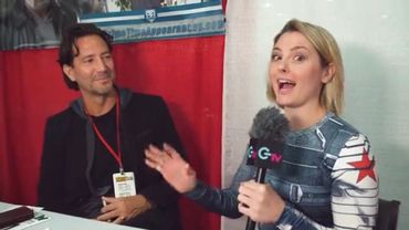 Motor City Comic con host Caitlin Burt with Henry Ian Cusick