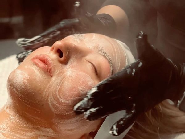 Professional deep facial cleaning using steam therapy