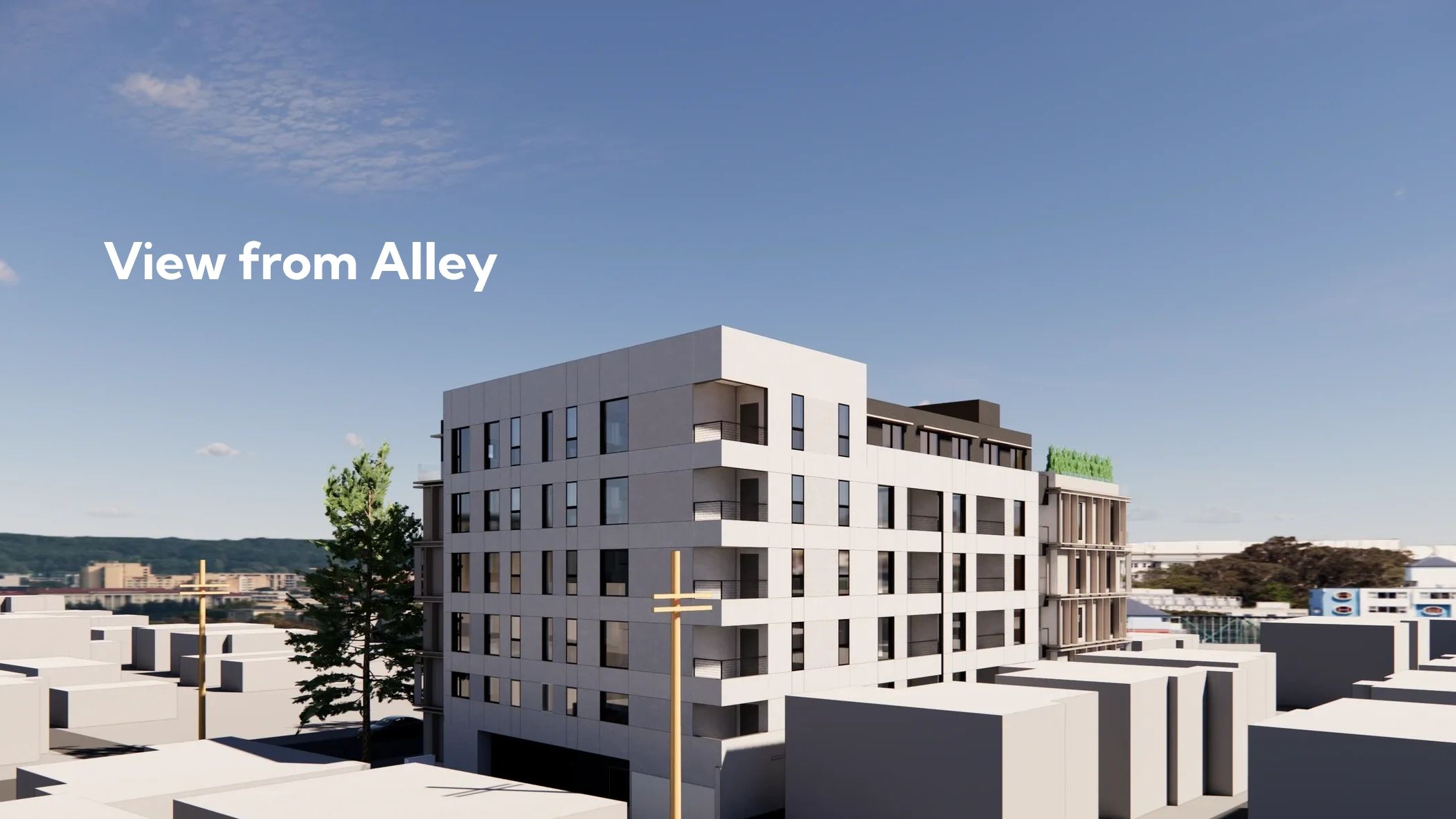Modern multi-story building seen from an alley under a clear blue sky.