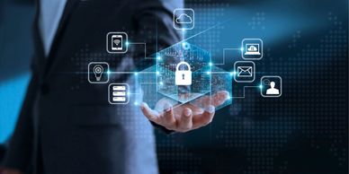 Businessman holding a digital lock symbolizing cybersecurity and data protection.