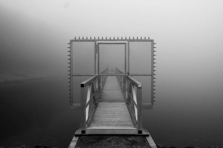 A pier with a gate blocking the way
