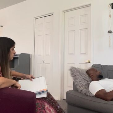 Crystal Estrella hypnotist in a hypnotherapy session doing hypnosis.