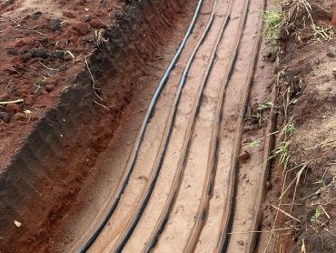 Trench with multiple cables laid inside.