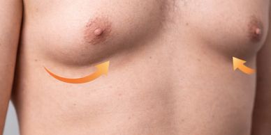 Close-up of a shirtless chest with directional arrows.
