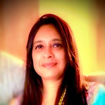 Portrait of a woman smiling gently.