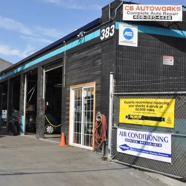 Exterior view of CS Autoworks, an auto repair shop with multiple service bays.