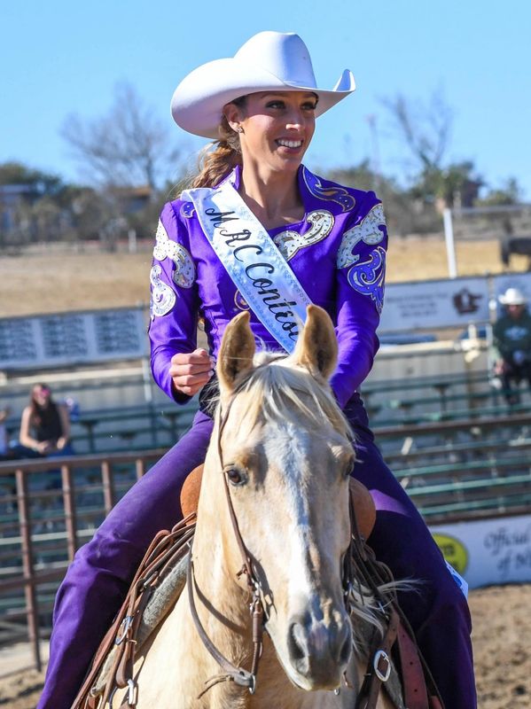 Whitney Iskenderian on palomino horse at rodeo