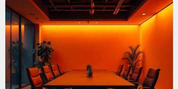 Modern conference room with orange lighting.