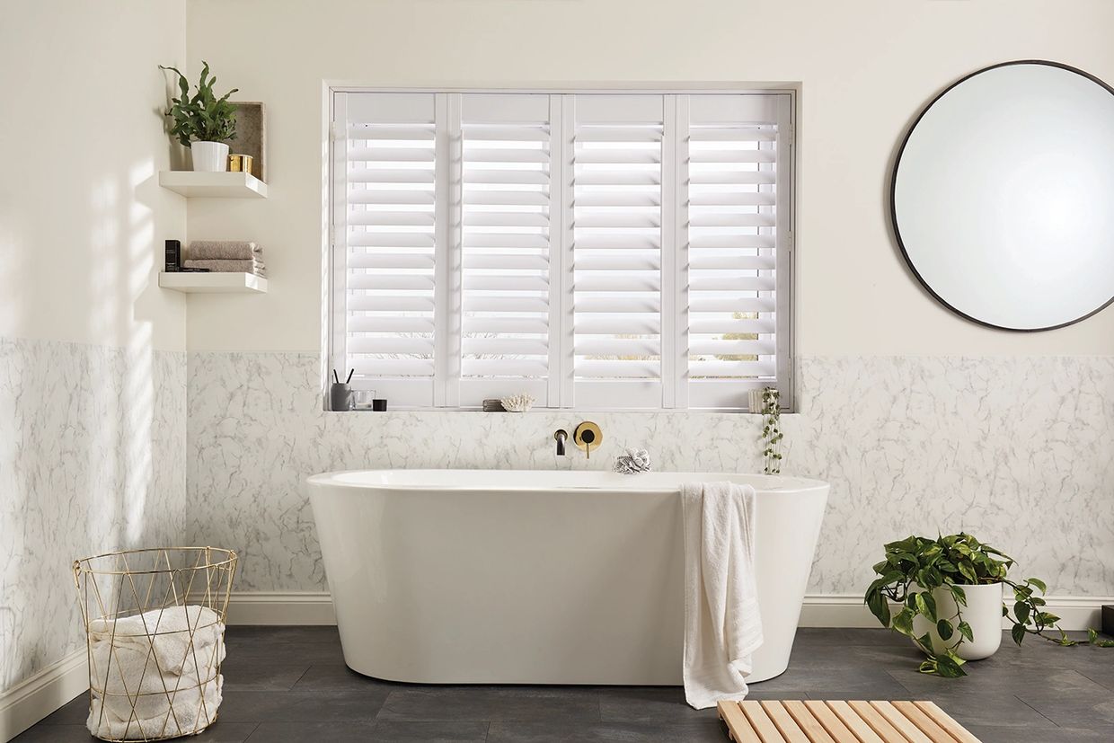 White bathroom window shutter