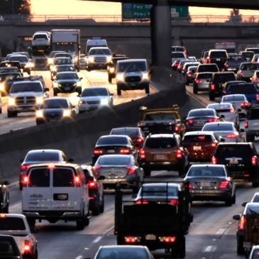 Heavy evening traffic on a multi-lane highway.