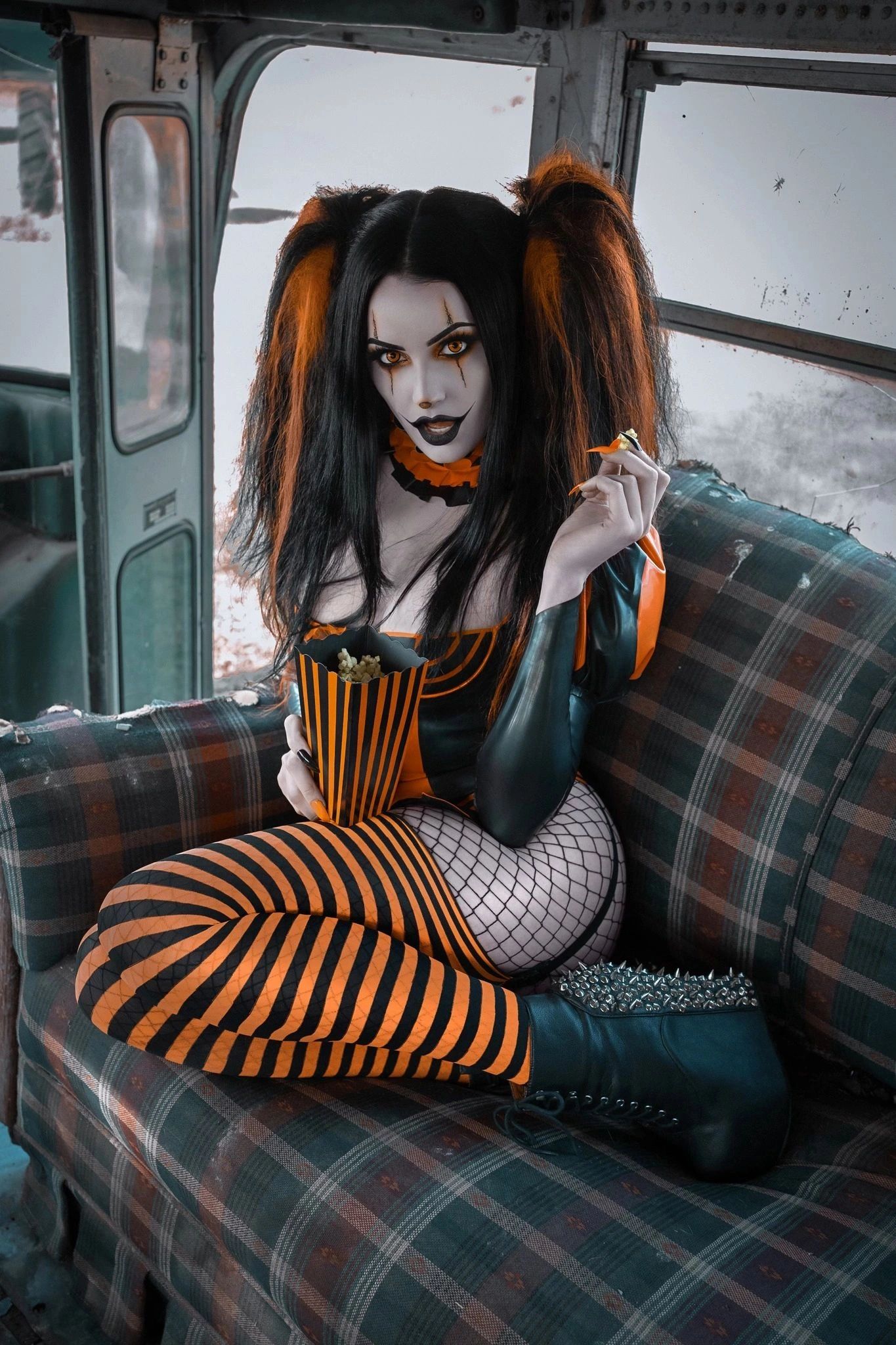 Halloween clown costume with popcorn inside a bus.