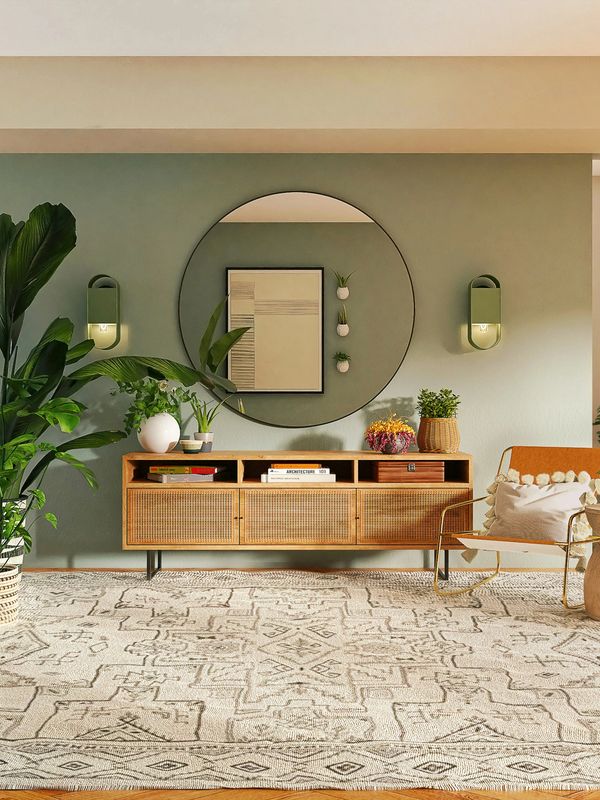Cozy living room with wooden furniture and plants.