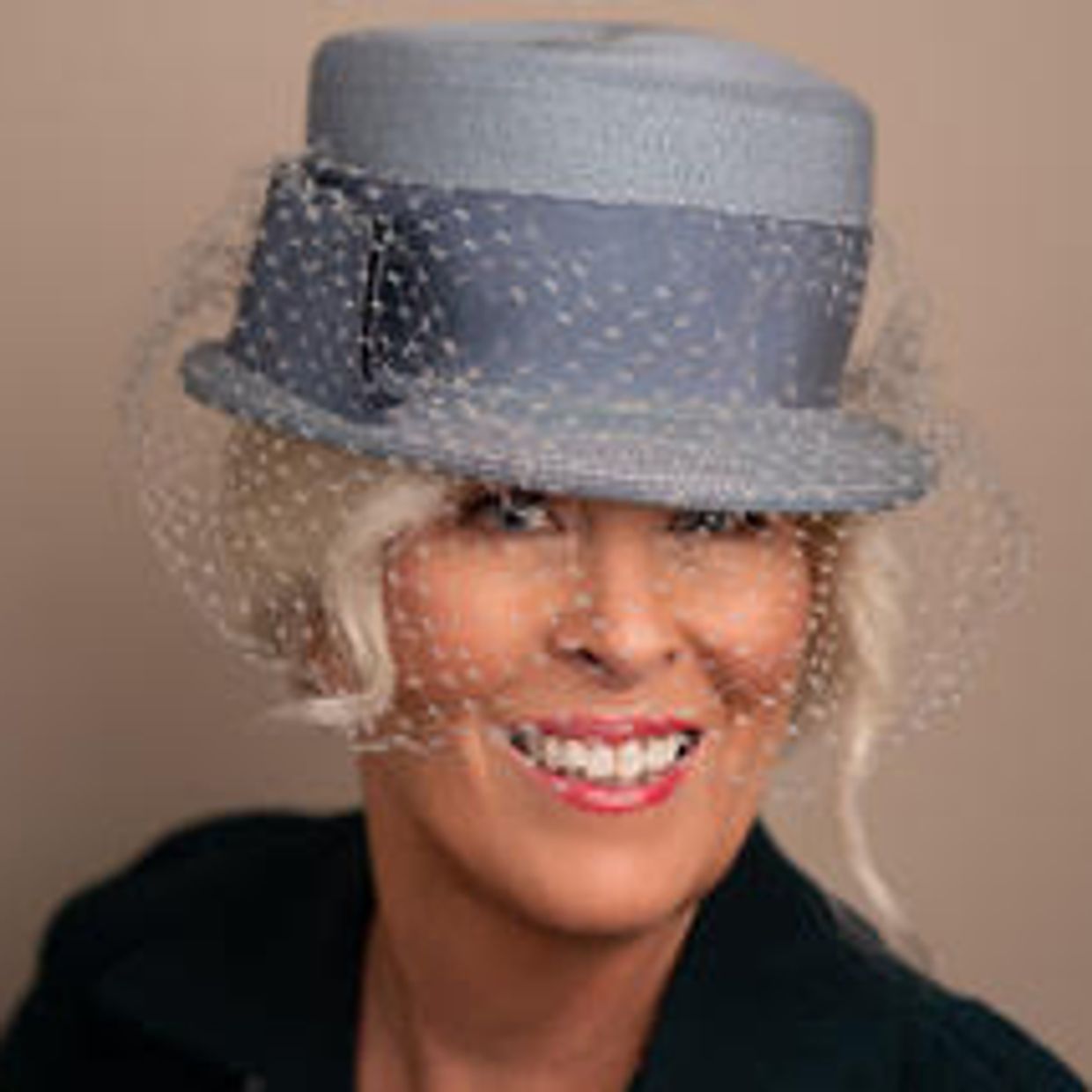 Artist Michelle Gorga in antique blue hat with veil.
