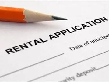 Close-up of a rental application form with a pencil.