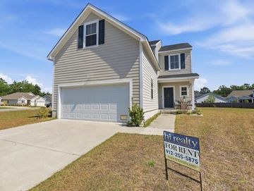 Modern two-story house with a 'For Rent' sign on the lawn.