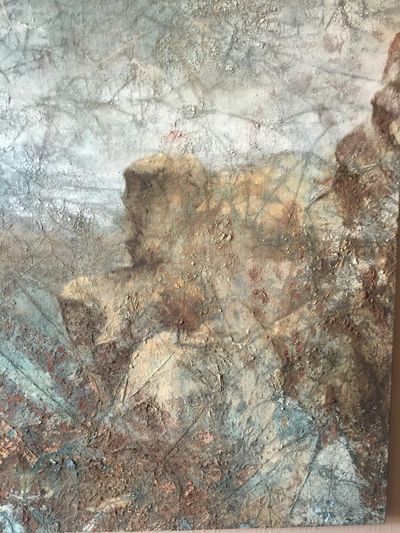 Abstract painting with textured, earthy tones and hints of blue.